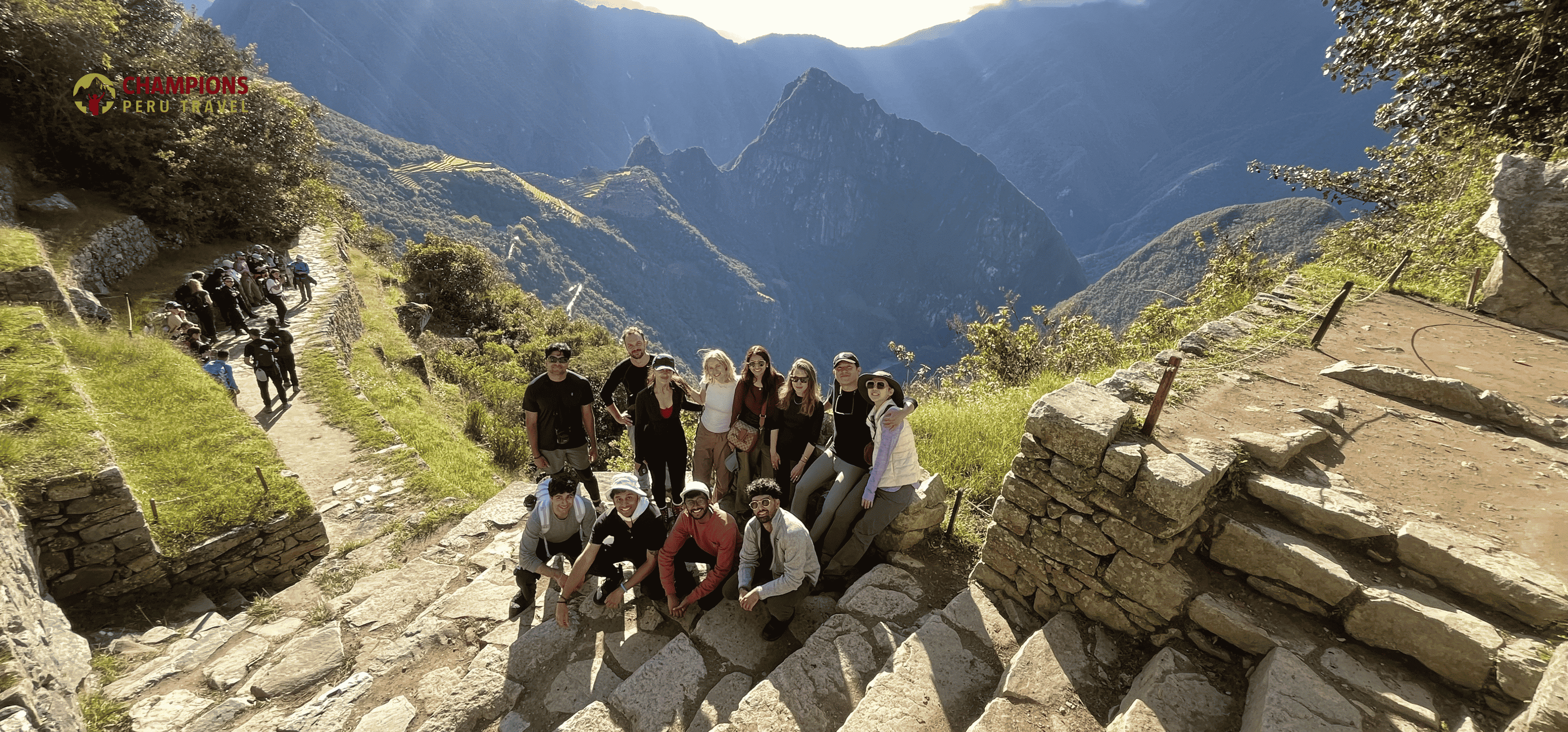 happy hikers at Sun Gate Machu Picchu after Short Inca Trail | Champions Peru Travel