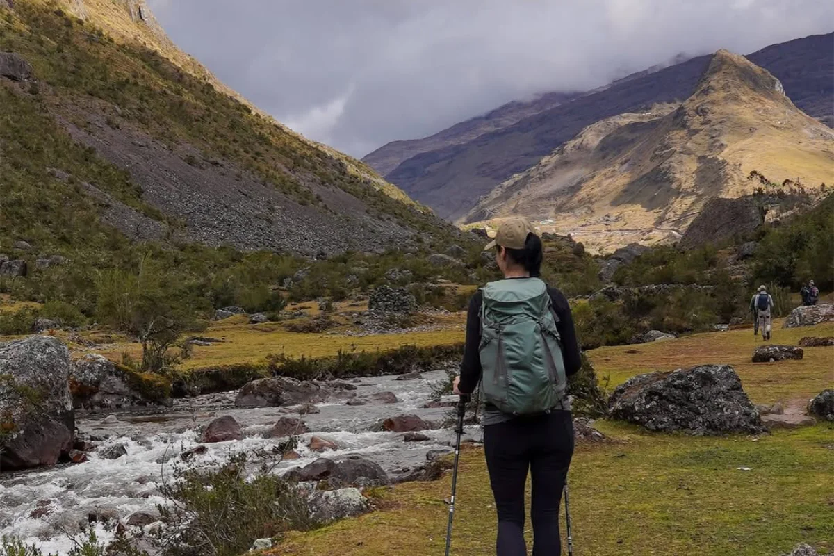 Hiker descending an Andean mountain trail