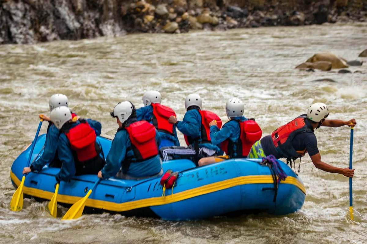 Travelers rafting on an Andean river