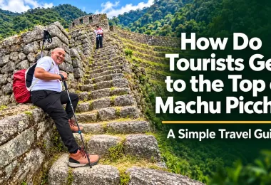 Tourist resting on ancient stone steps while hiking toward the top of Machu Picchu in Peru.