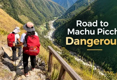 Hikers with backpacks walking along a narrow mountain trail in Peru while following safety tips for traveling to Machu Picchu.