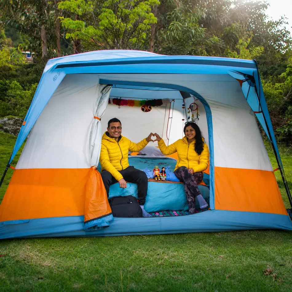 Happy hikers inside their sleeping tent on the 4 Day Luxury Inca Trail Tour